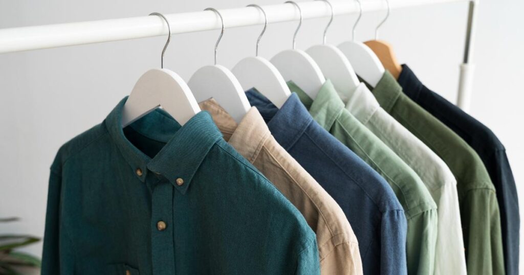 Jeans hanging neatly on wall hooks instead of being thrown on the floor.