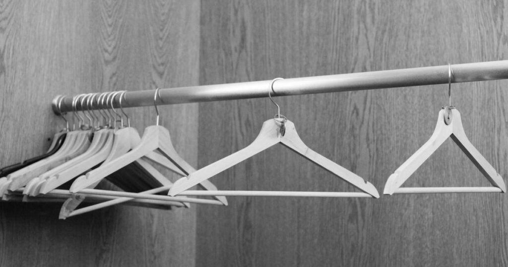 A close-up showing a hanger hook facing outwards to start the trick.