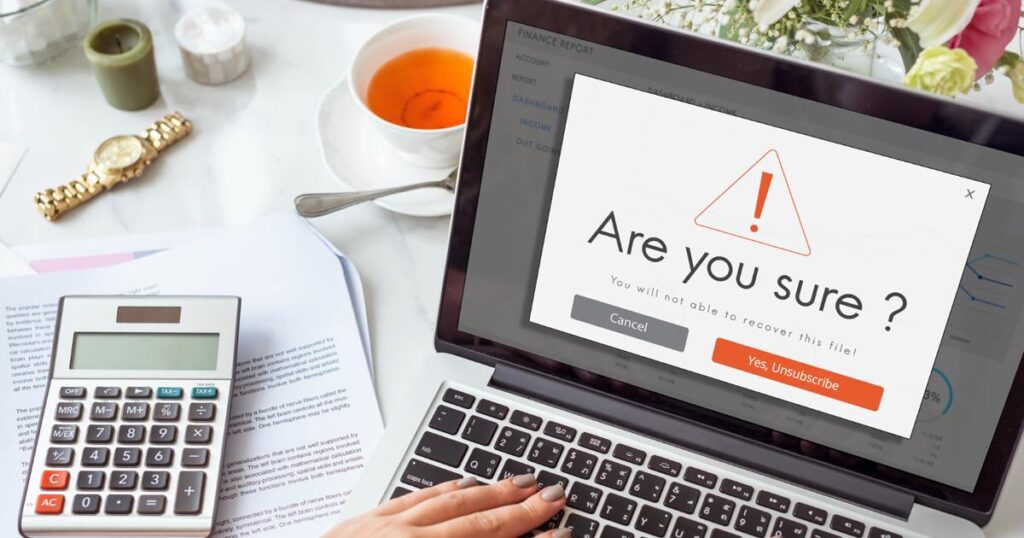 A cursor hovering over a large "Cancel Subscription" button on a computer screen.
