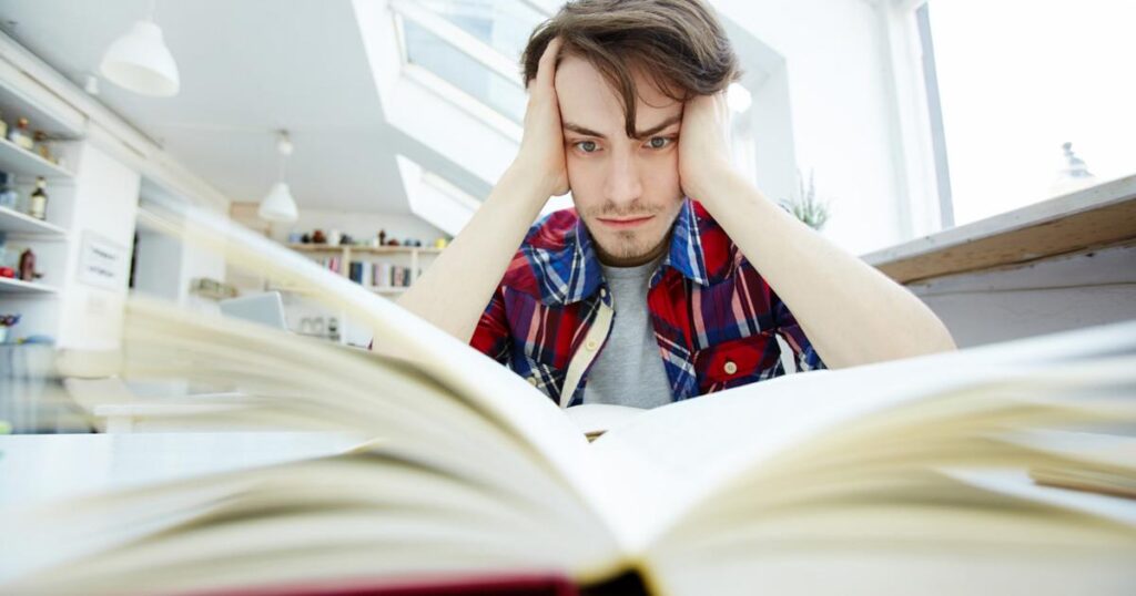 Closing a boring book halfway through to save time.