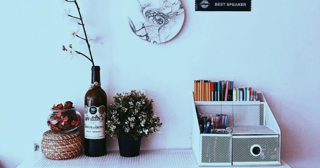 A drawer organizer filled neatly with pens and office supplies, showing the container rule.