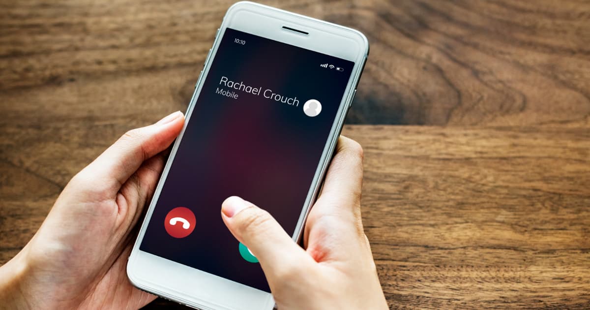 A finger hovering over the red decline button on a smartphone screen.