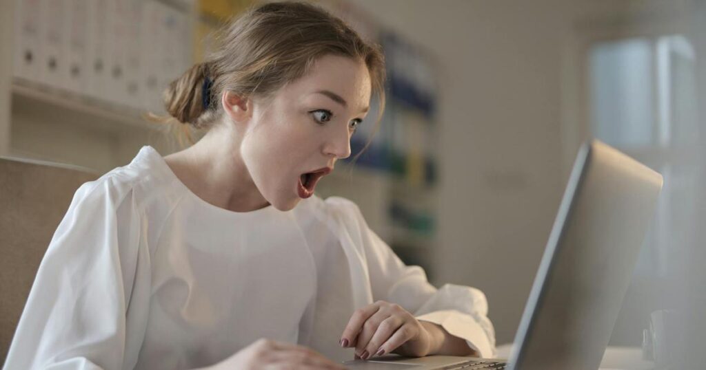 A person looking at colorful charts and graphs on a computer screen representing Discord statistics.