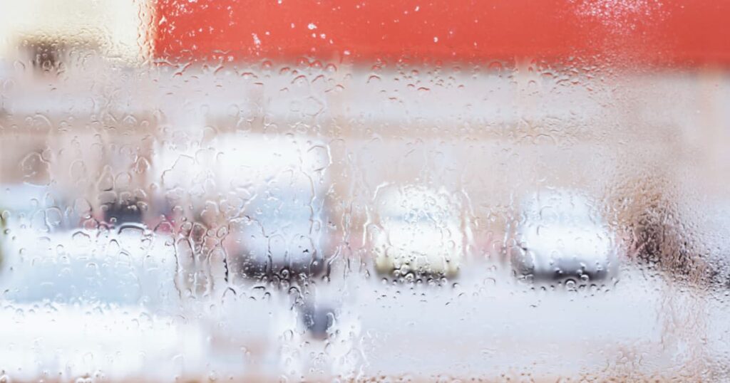 A bathroom mirror fogged up with steam, showing the humidity that causes mold.