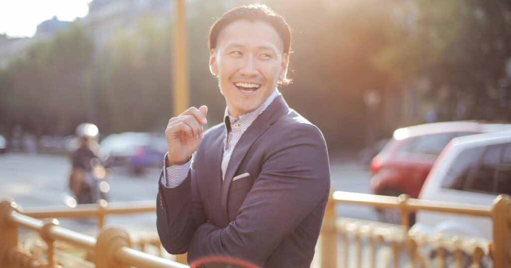 A happy person leaving the office early in the afternoon because they finished their work efficiently.