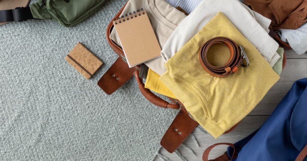 Clothes and a bag laid out neatly on a chair, ready for the next morning.