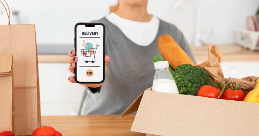 A laptop screen showing an online grocery cart with a list of items.