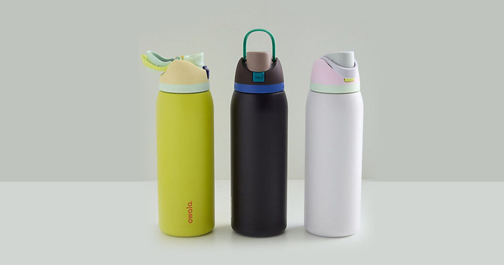 Owala water bottle with stickers on a desk