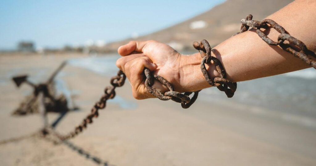 A heavy anchor representing the weight of past investments dragging you down.