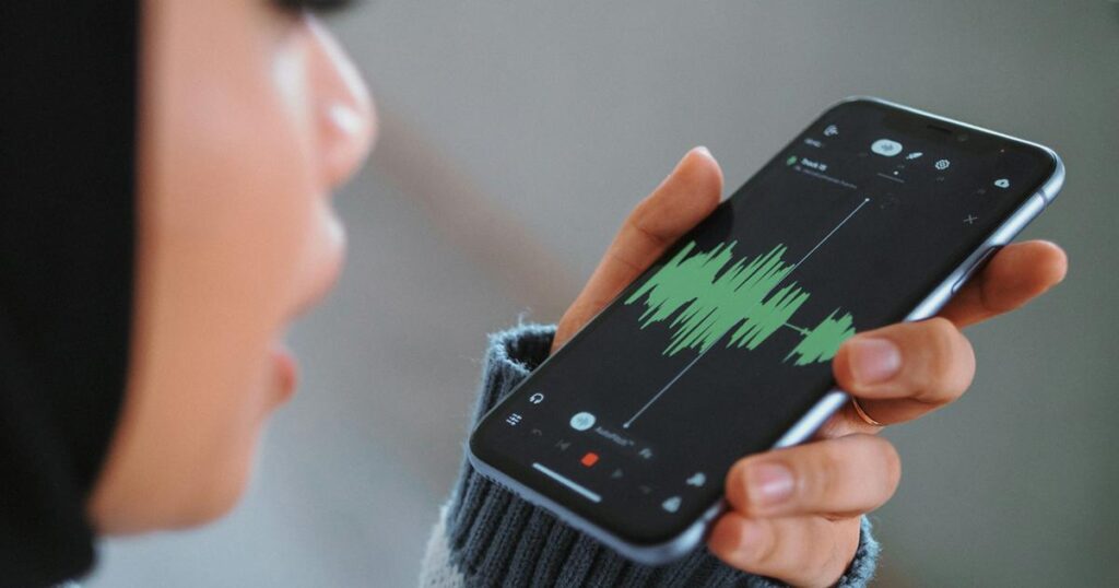 A smartphone showing the voice memo app recording a personal note.
