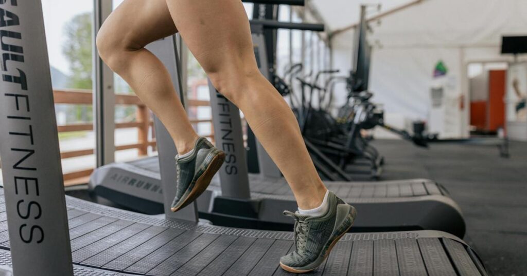 Running shoes ready by the door, representing the first small step of action.