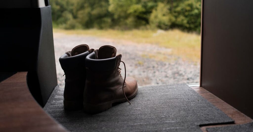 A pair of shoes sitting by the front door, waiting to be put on at the last minute.