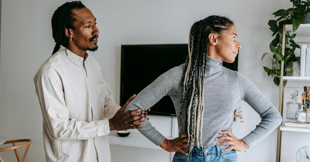 An illustration of a person hiding behind a shield labeled Sorry to avoid conflict.