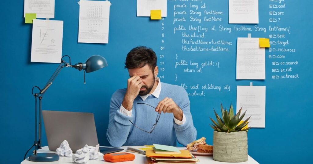 A person walking away from a bad investment, illustrating the Sunk Cost Fallacy.